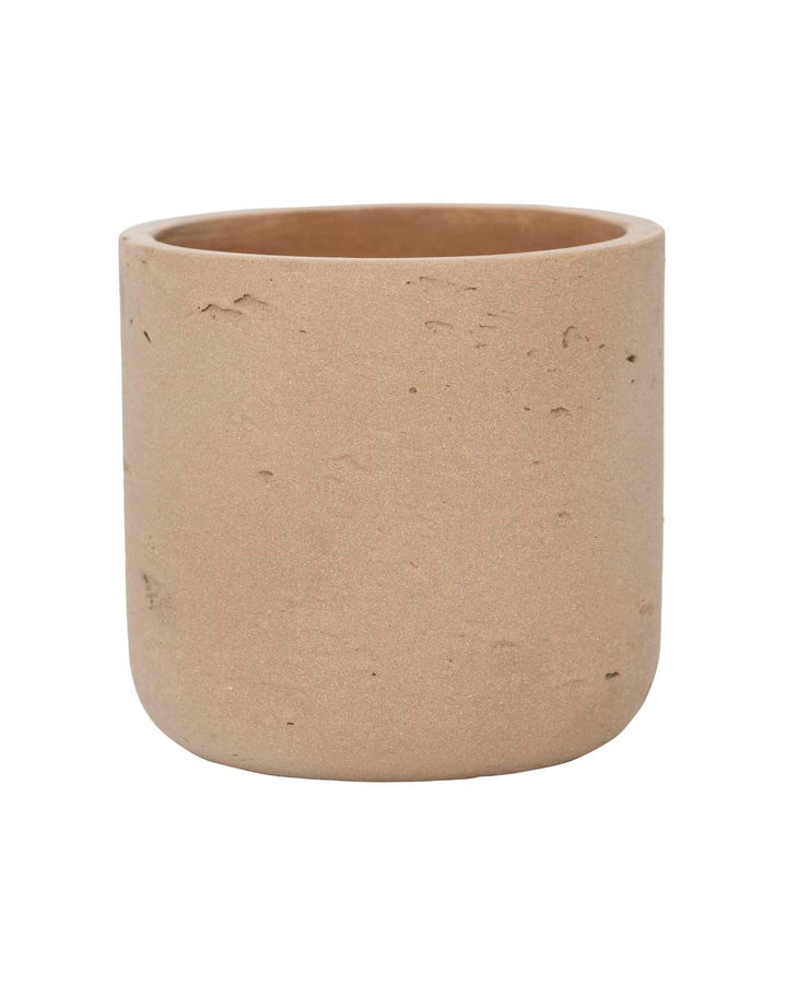 Beige ceramic pot on a white background